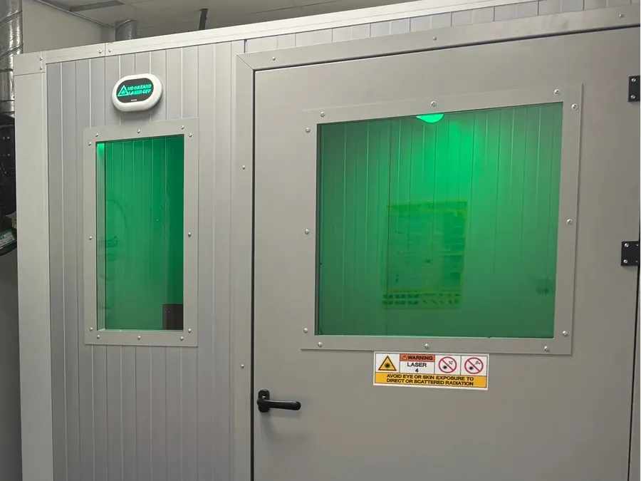 2.44 × 2.28 × 2.70 m Cepro Unisonic laser welding booth with single door, vision panel, roof enclosure, and 600 × 600 mm side window. — image 2