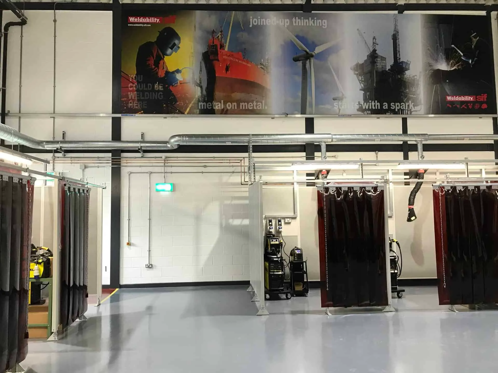 Modern welding training facility with welding booths